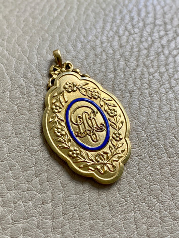 1928 Detailed 18k gold medallion pendant with blue enamel “For 21 years of faithful service”