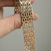 Mixed gold link bracelet in hand. Penelope Penelope Vintage Gold Jewelry