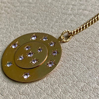 13 stone stars in circles within a solid 18k gold pendant. Hallmarks visible on jump ring