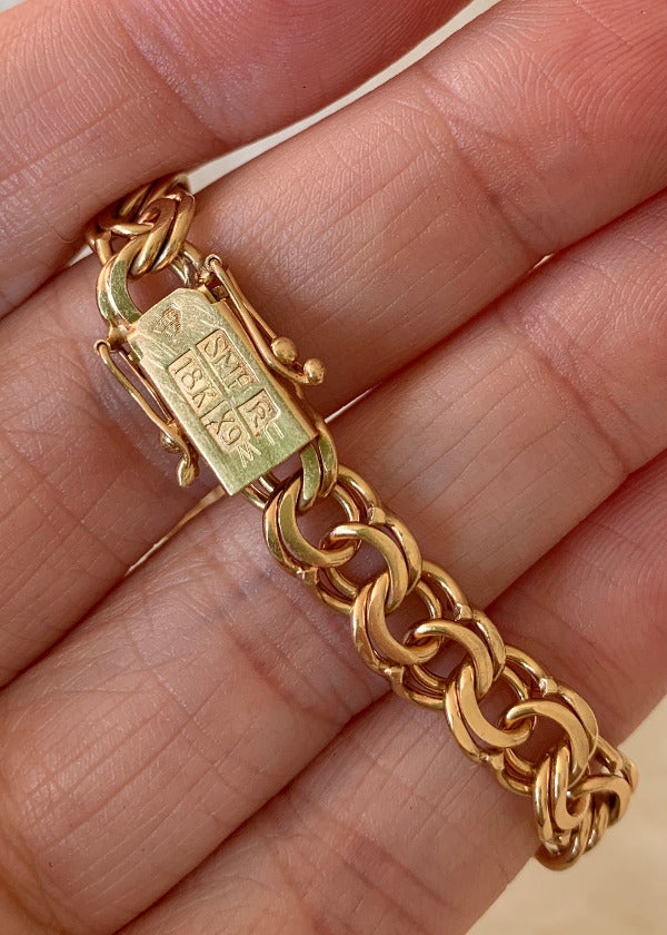 Double link solid 18k gold bracelet 1972  Swedish vintage, 18K gold, 7 inch in inside circumference, a chunky 17.8 grams, perfect working clasp, fully hallmarked, sun catching radiant double link, GORGEOUS!!!! She is a classic you'll wear every day. 18k Yellow gold with a subtle warm rosy tint - stunning.  This link type is called a double-link. Pairs of links run side by side - like two curb chains delicately soldered, link by link, to form a double length of links.