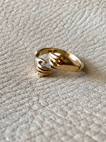 A symbol of affection, a gold hug for your hand. Yellow solid 18k gold vintage embrace ring. Crisp hallmarks for maker and gold purity. Size 8