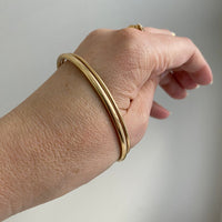 Closed bangles must fit over the widest part of your hand