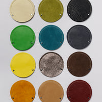 Grid of round cable cases showing 12 color variations.